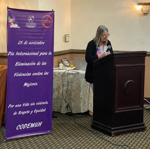 Anne Wichmann speaking about violence against women in the workplace at the Voces de Mujeres in la Maquila forum in Honduras.